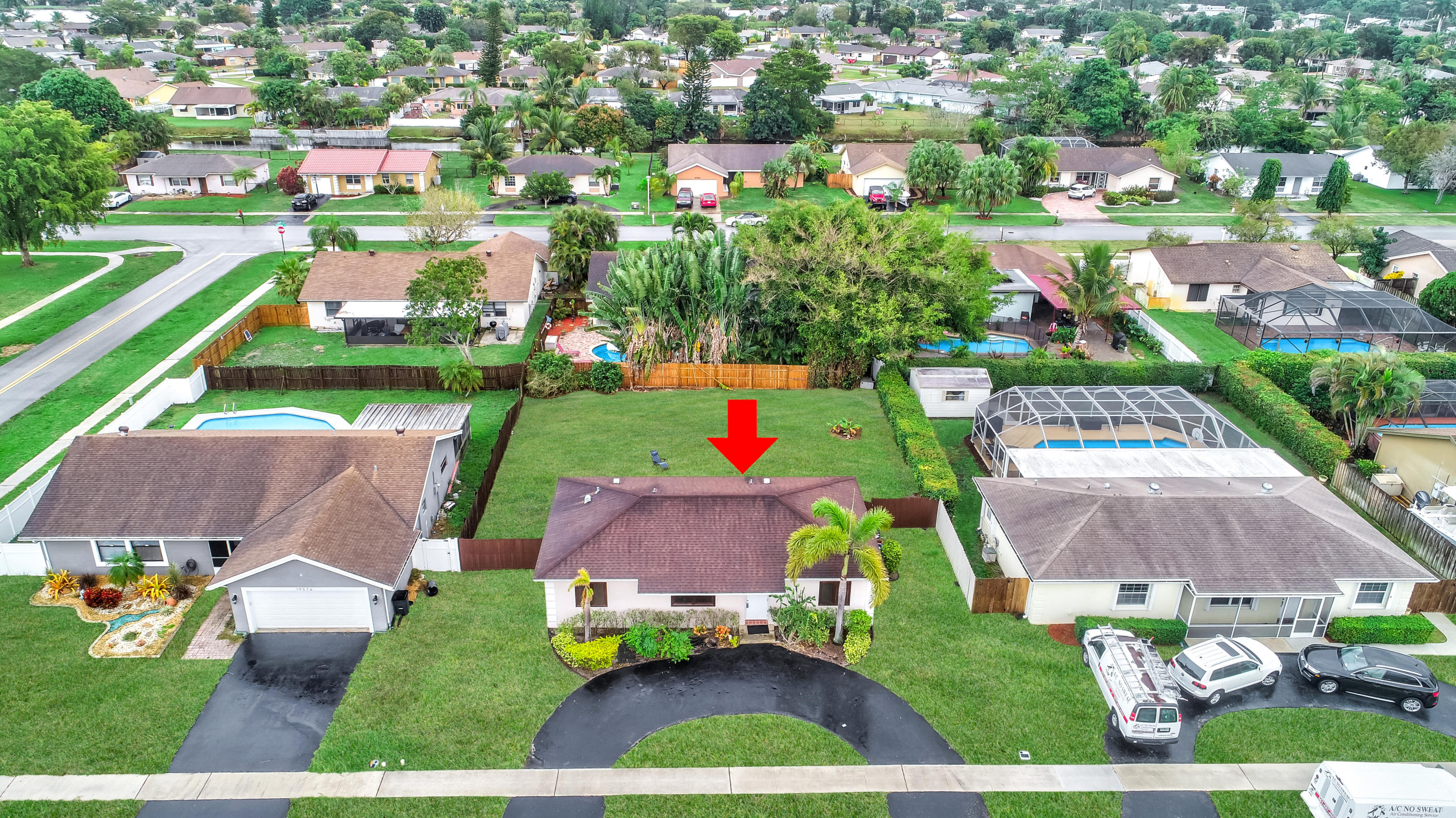 19594 Liberty Road Boca Raton, FL 33434 - Photo 43 of 53 an aerial view of residential houses with outdoor space and parking