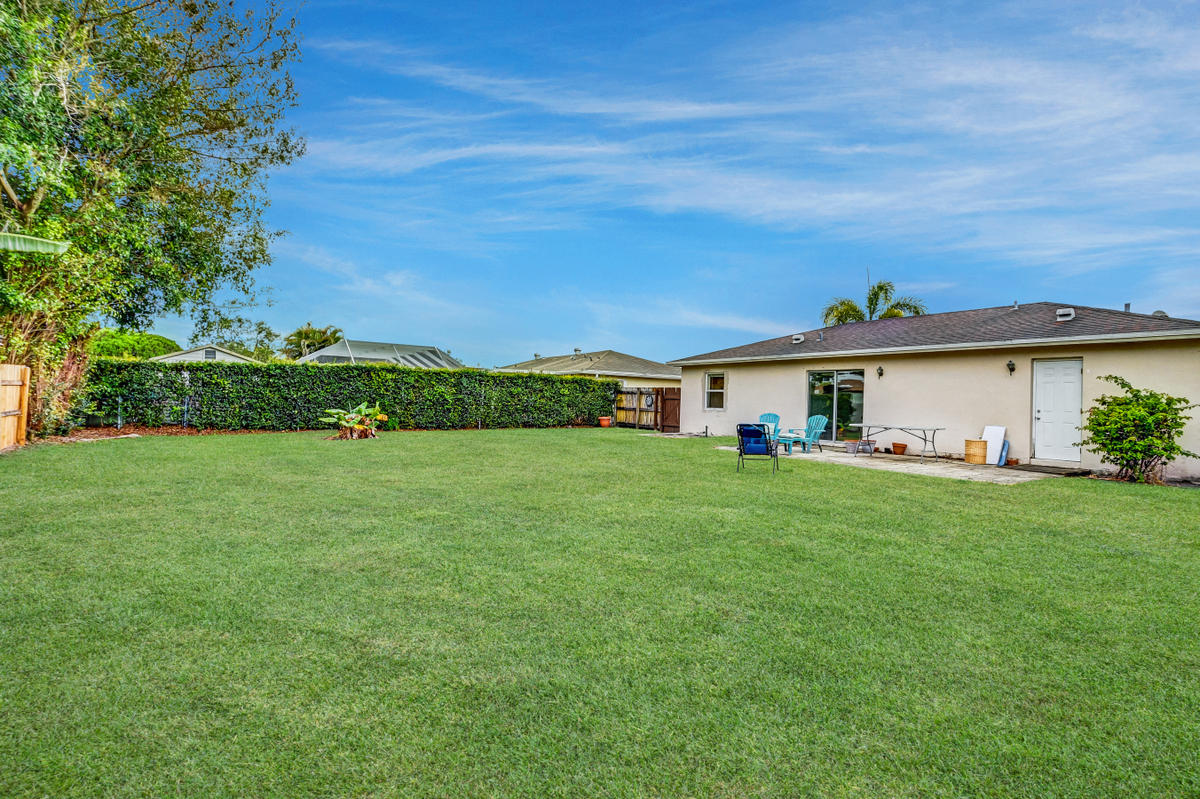 19594 Liberty Road Boca Raton, FL 33434 - Photo 50 of 53 a front view of a house with a yard