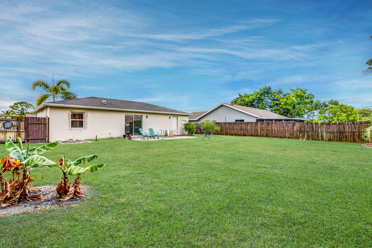 19594 Liberty Road Boca Raton, FL 33434 - Photo 5 of 53 a view of a house with a backyard