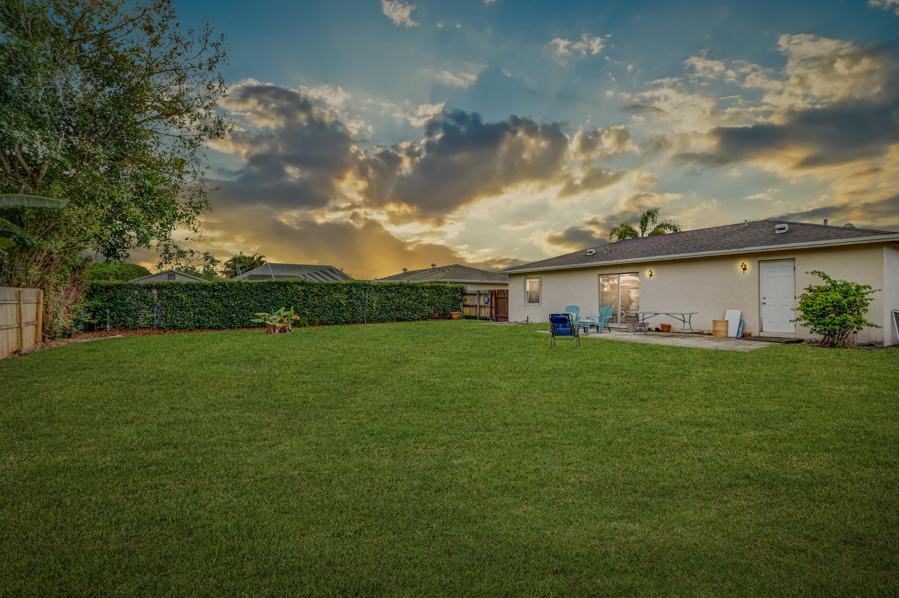 19594 Liberty Road Boca Raton, FL 33434 - Photo 51 of 53 a front view of a house with a garden