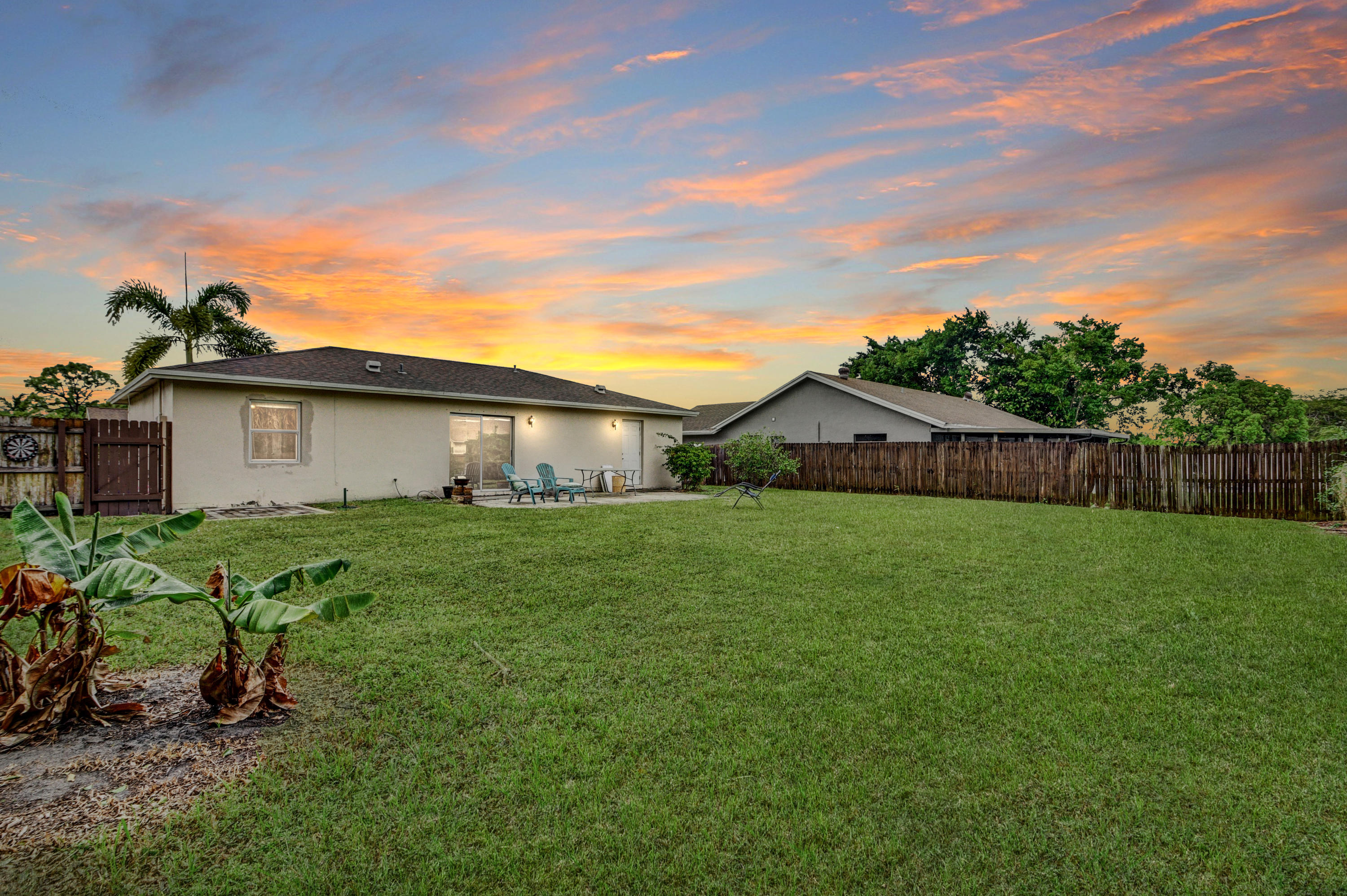19594 Liberty Road Boca Raton, FL 33434 - Photo 52 of 53 a view of a house with backyard and garden
