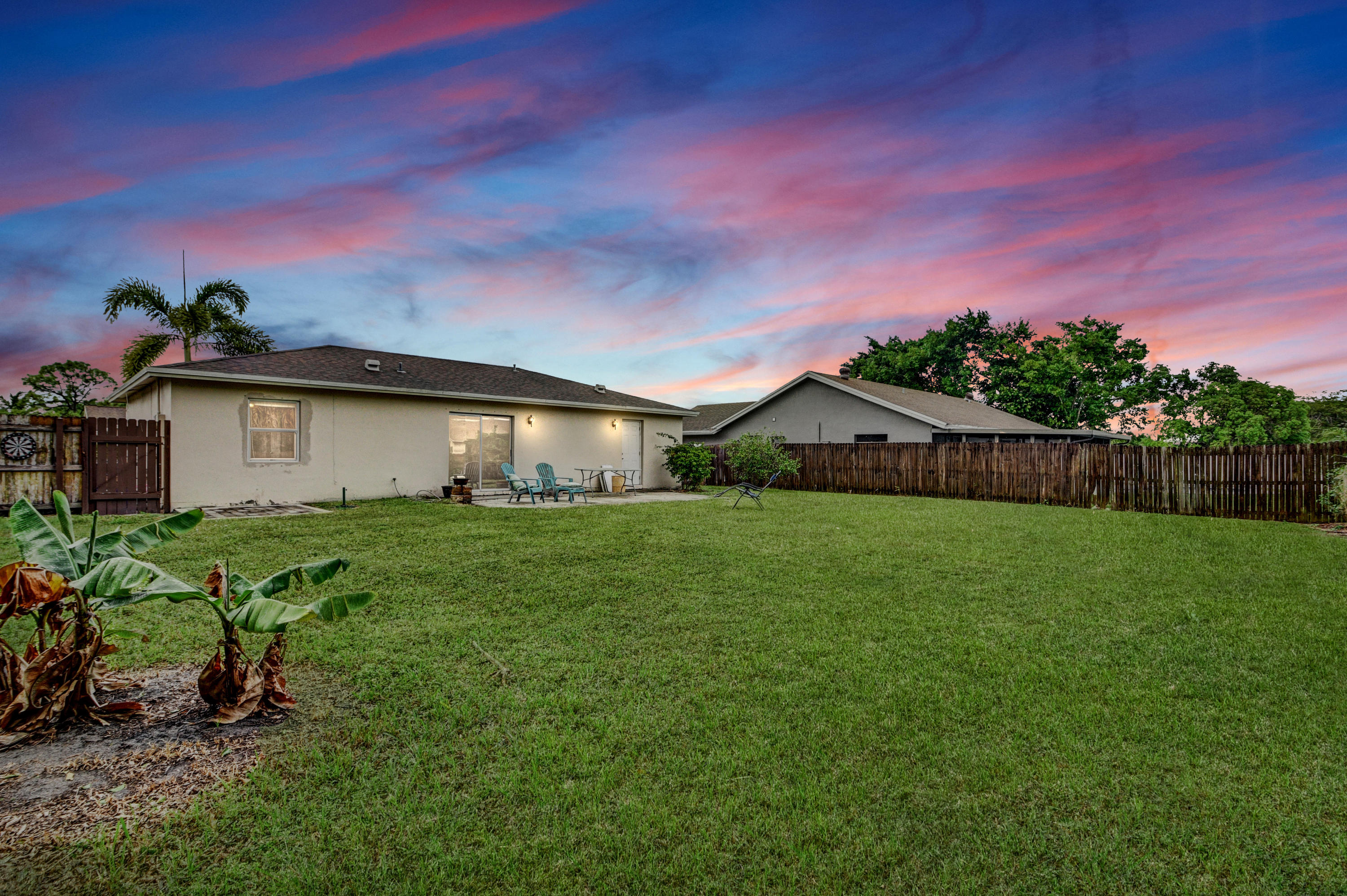 19594 Liberty Road Boca Raton, FL 33434 - Photo 6 of 53 a front view of a house with garden