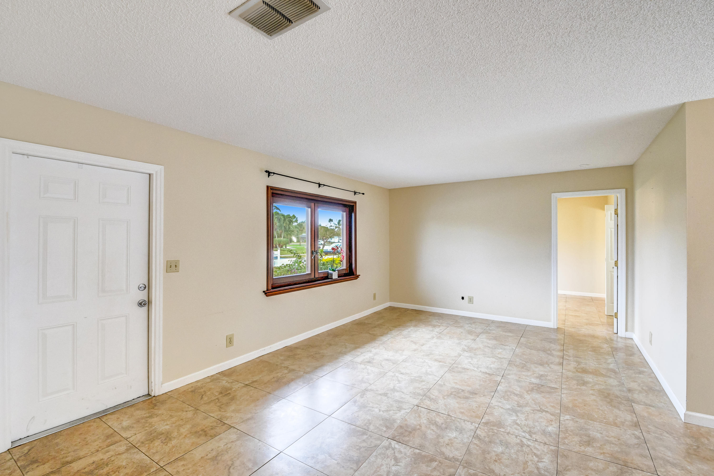 19594 Liberty Road Boca Raton, FL 33434 - Photo 7 of 53 a view of an empty room with a window