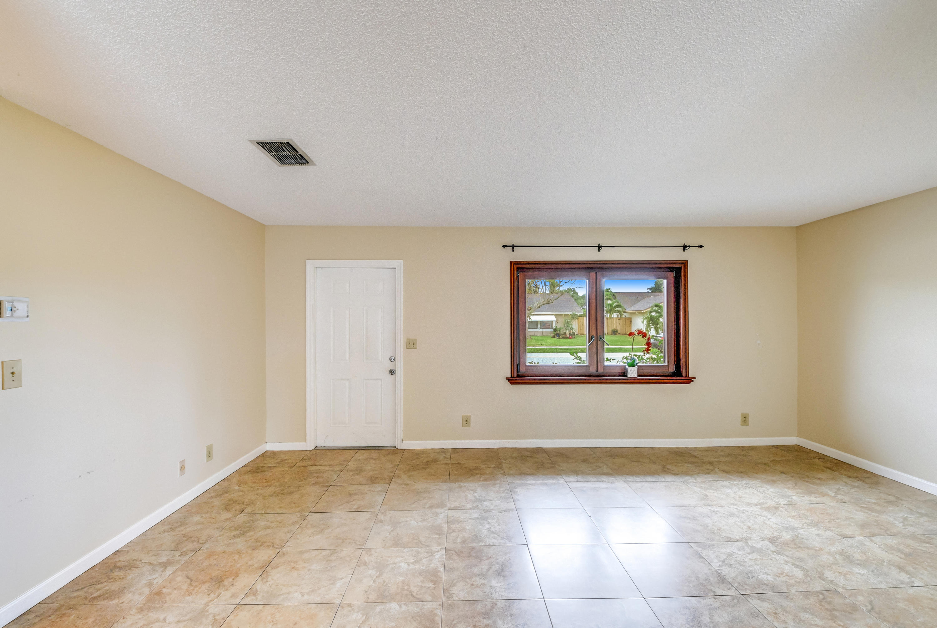 19594 Liberty Road Boca Raton, FL 33434 - Photo 10 of 53 an empty room with a window