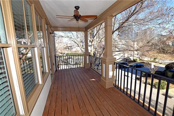 a view of a porch with wooden floor