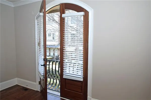 a view of front door with wooden floor
