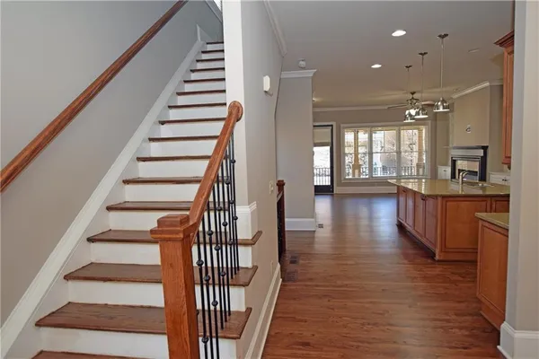 a view of an entryway with wooden floor and windows