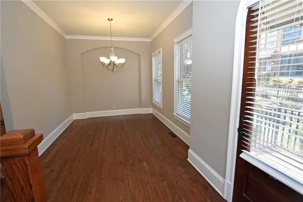 a view of a livingroom with wooden floor