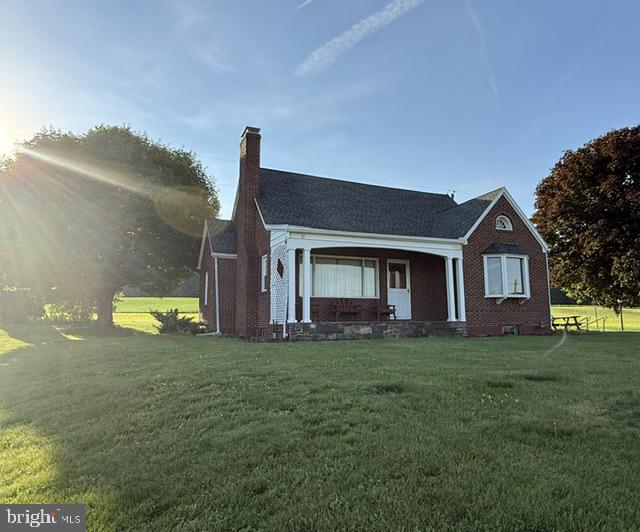 19642 Raystown Road James Creek, PA 16657 - Photo 4 of 42 Charming brick home bathed in sunlight.