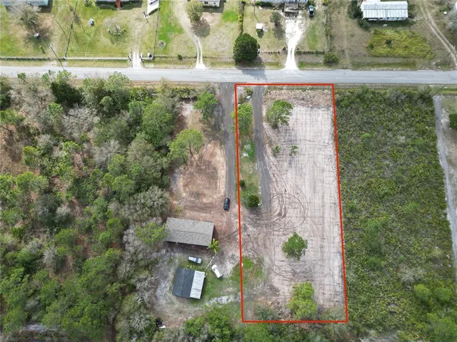 an aerial view of residential house with outdoor space
