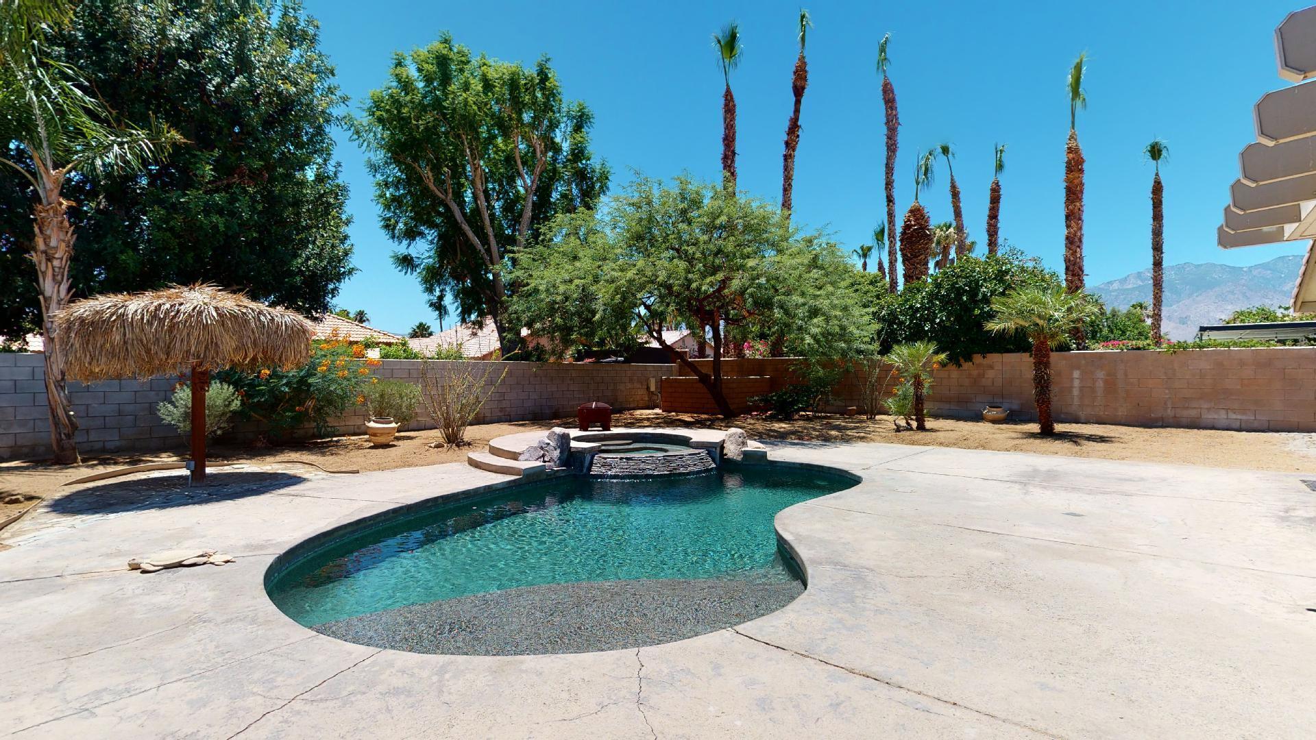 68373 Durango Road Cathedral City, CA 92234 - Photo 1 of 44 a view of a swimming pool with a yard and plants