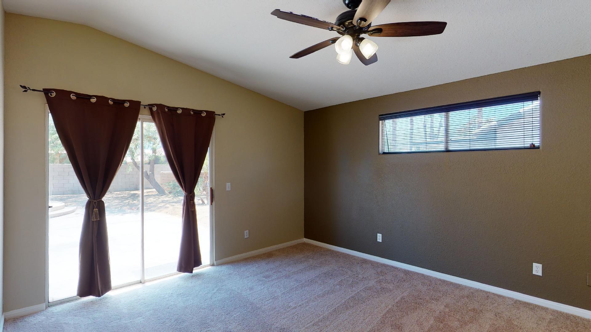 68373 Durango Road Cathedral City, CA 92234 - Photo 28 of 44 a view of empty room with window and ceiling fan