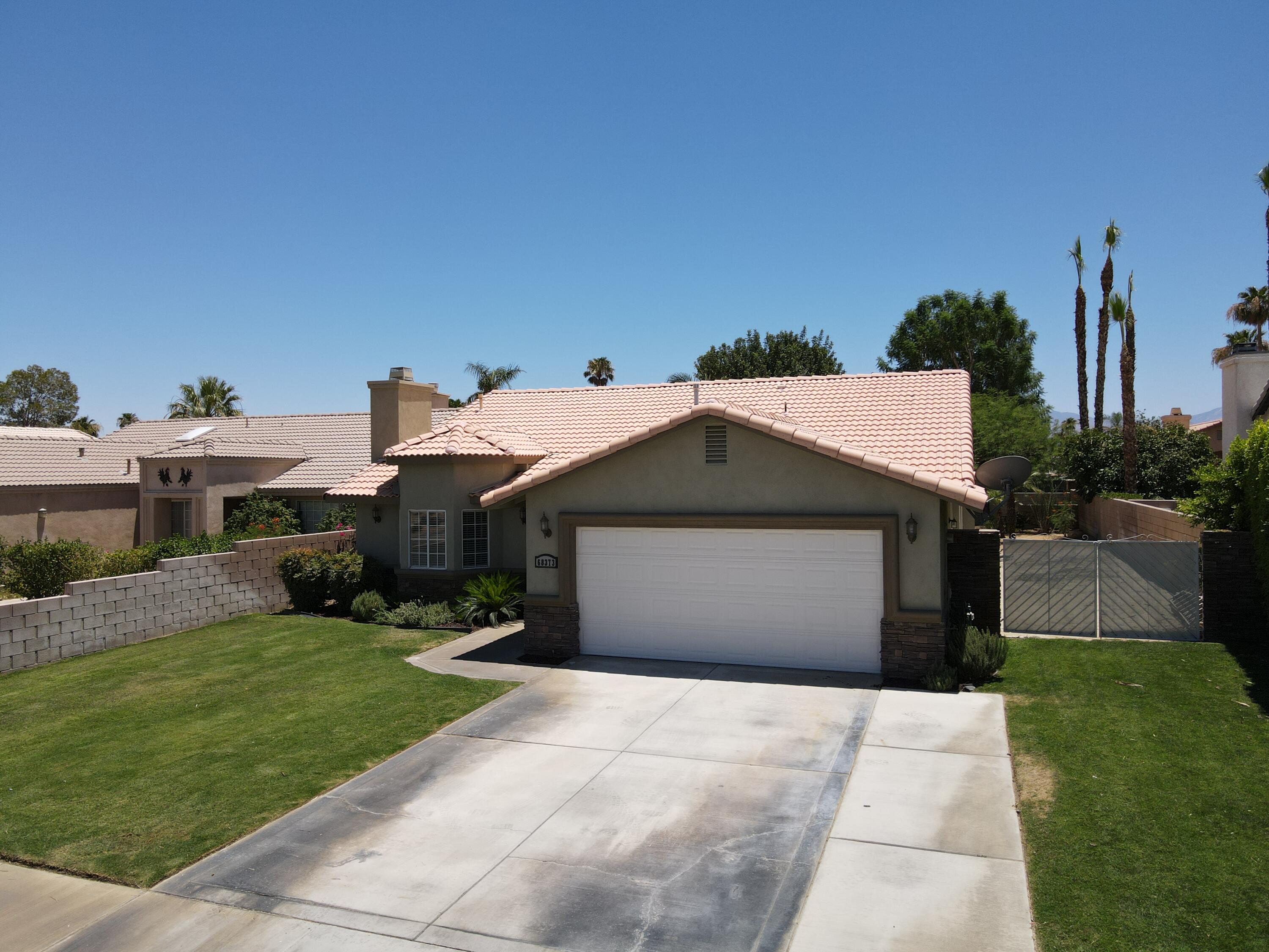 68373 Durango Road Cathedral City, CA 92234 - Photo 37 of 44 a front view of a house with a yard