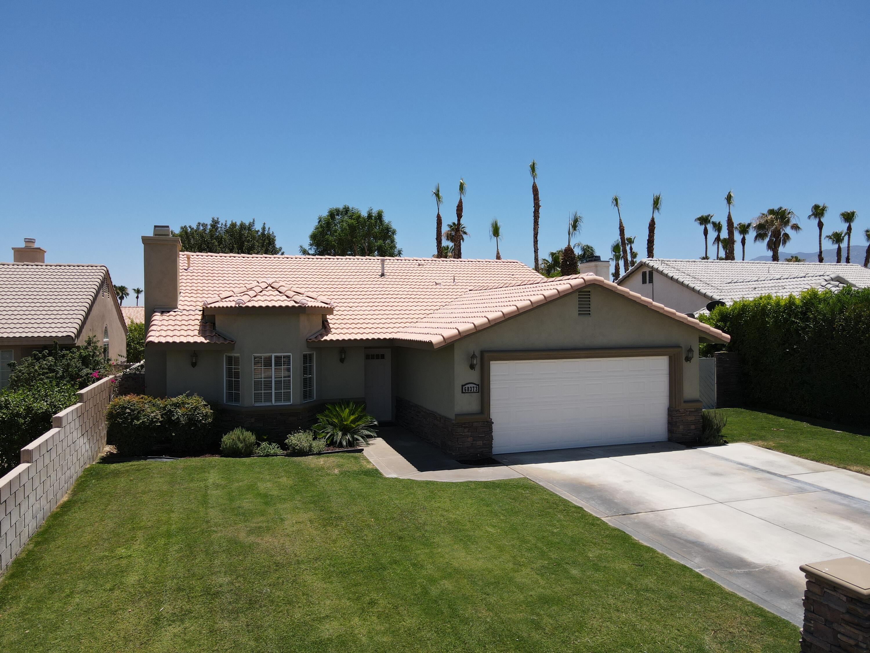 68373 Durango Road Cathedral City, CA 92234 - Photo 38 of 44 a front view of a house with a garden