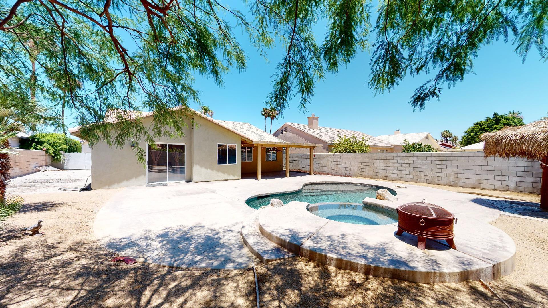 68373 Durango Road Cathedral City, CA 92234 - Photo 4 of 44 a view of a house with swimming pool and sitting area