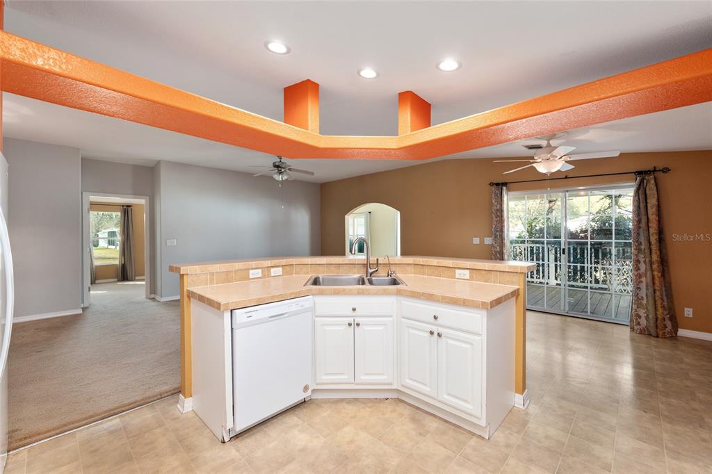 7863 Southwest 6th Place Ocala, FL 34474 - Photo 16 of 60 a view of a kitchen with a sink and wooden floor