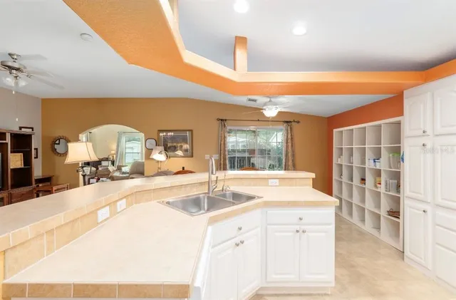 a kitchen with stainless steel appliances a stove microwave and cabinets