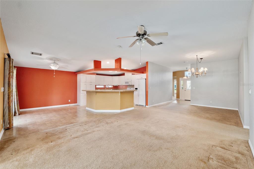 7863 Southwest 6th Place Ocala, FL 34474 - Photo 21 of 60 a view of a kitchen with a stove and a chandelier