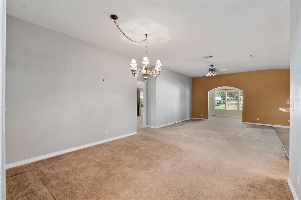 7863 Southwest 6th Place Ocala, FL 34474 - Photo 24 of 60 a view of a livingroom with a chandelier