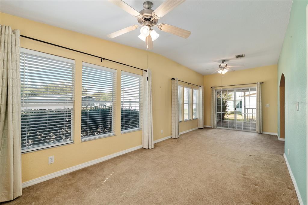 7863 Southwest 6th Place Ocala, FL 34474 - Photo 29 of 60 a view of livingroom with an entryway and ceiling fan