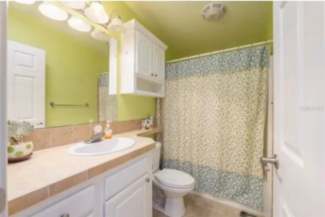 a utility room with sink dryer and washer