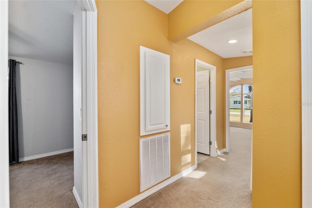 7863 Southwest 6th Place Ocala, FL 34474 - Photo 39 of 60 a view of a hallway with wooden floor