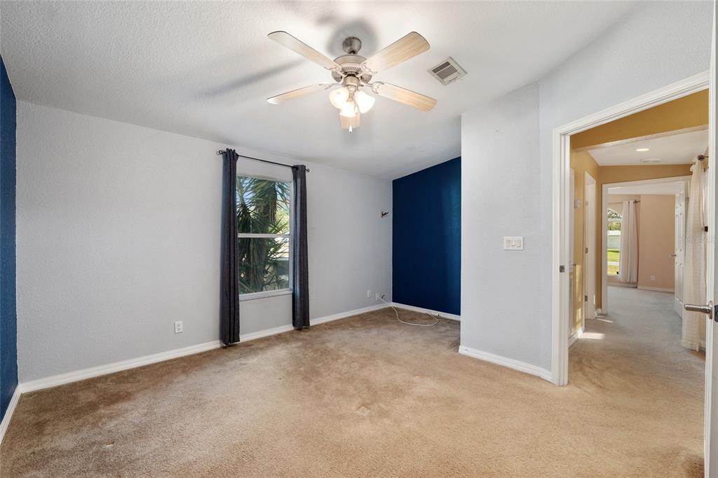 7863 Southwest 6th Place Ocala, FL 34474 - Photo 40 of 60 an empty room with fan and windows