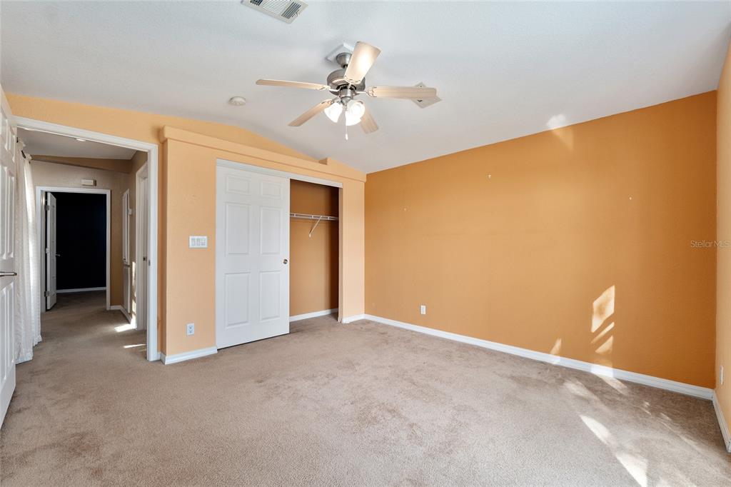 7863 Southwest 6th Place Ocala, FL 34474 - Photo 43 of 60 a view of an empty room with a chandelier fan