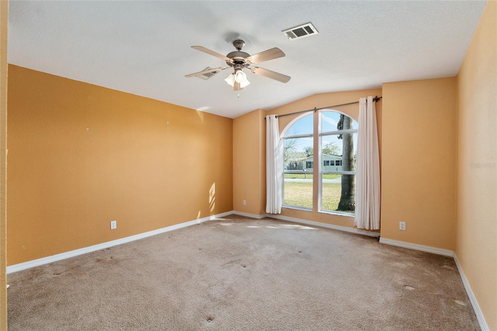 7863 Southwest 6th Place Ocala, FL 34474 - Photo 44 of 60 a view of a livingroom with a ceiling fan and window