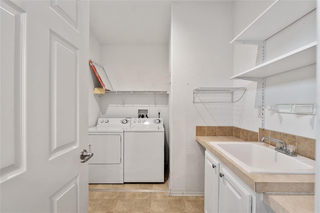 7863 Southwest 6th Place Ocala, FL 34474 - Photo 45 of 60 a utility room with dryer and washer