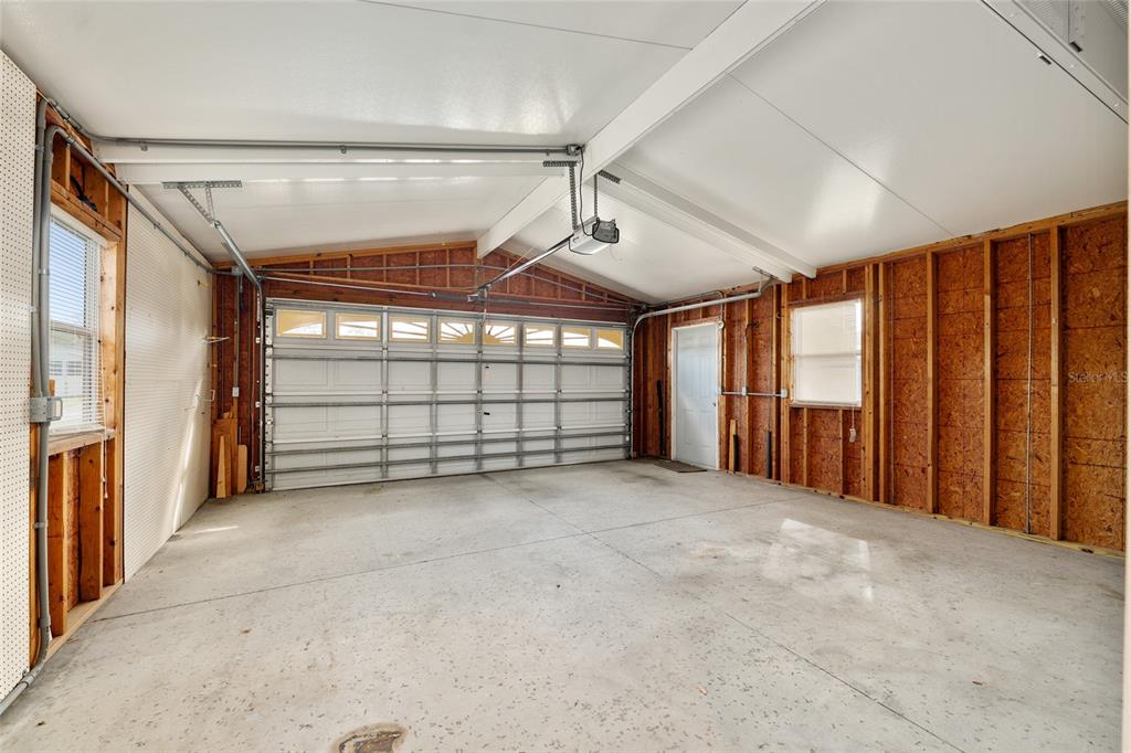 7863 Southwest 6th Place Ocala, FL 34474 - Photo 48 of 60 a view of an empty room with a fireplace and windows