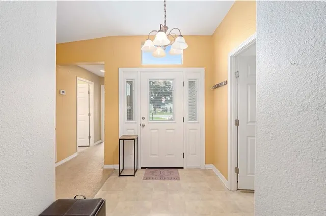 a view of entryway with chandelier