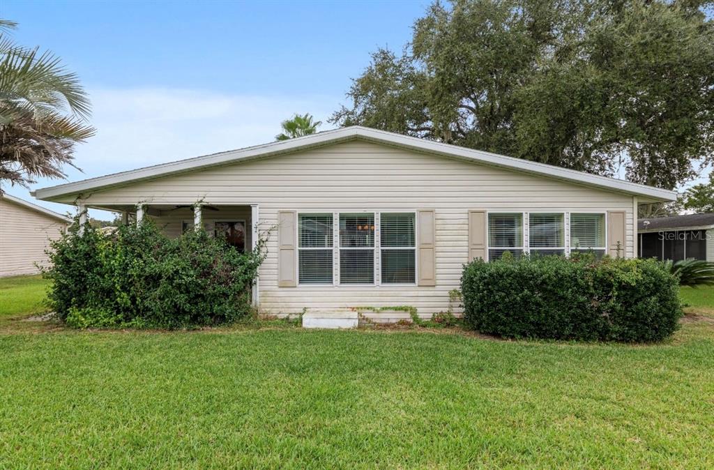 7863 Southwest 6th Place Ocala, FL 34474 - Photo 54 of 60 a front view of house with yard and green space