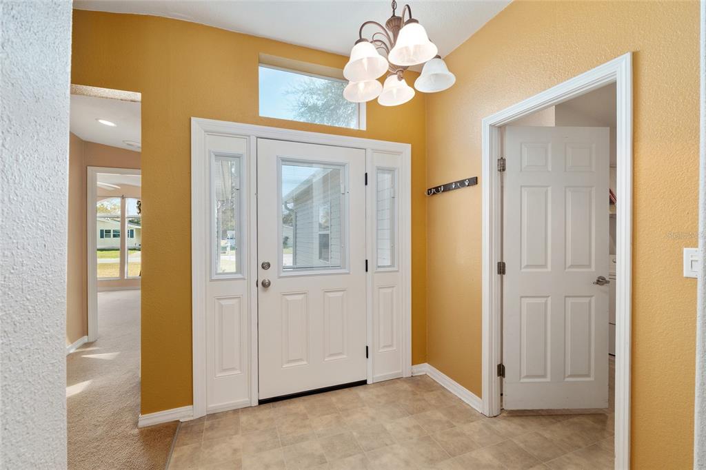 7863 Southwest 6th Place Ocala, FL 34474 - Photo 6 of 60 wooden floor in an empty room with a window