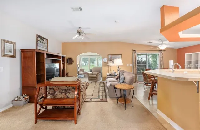 a living room with furniture and a window