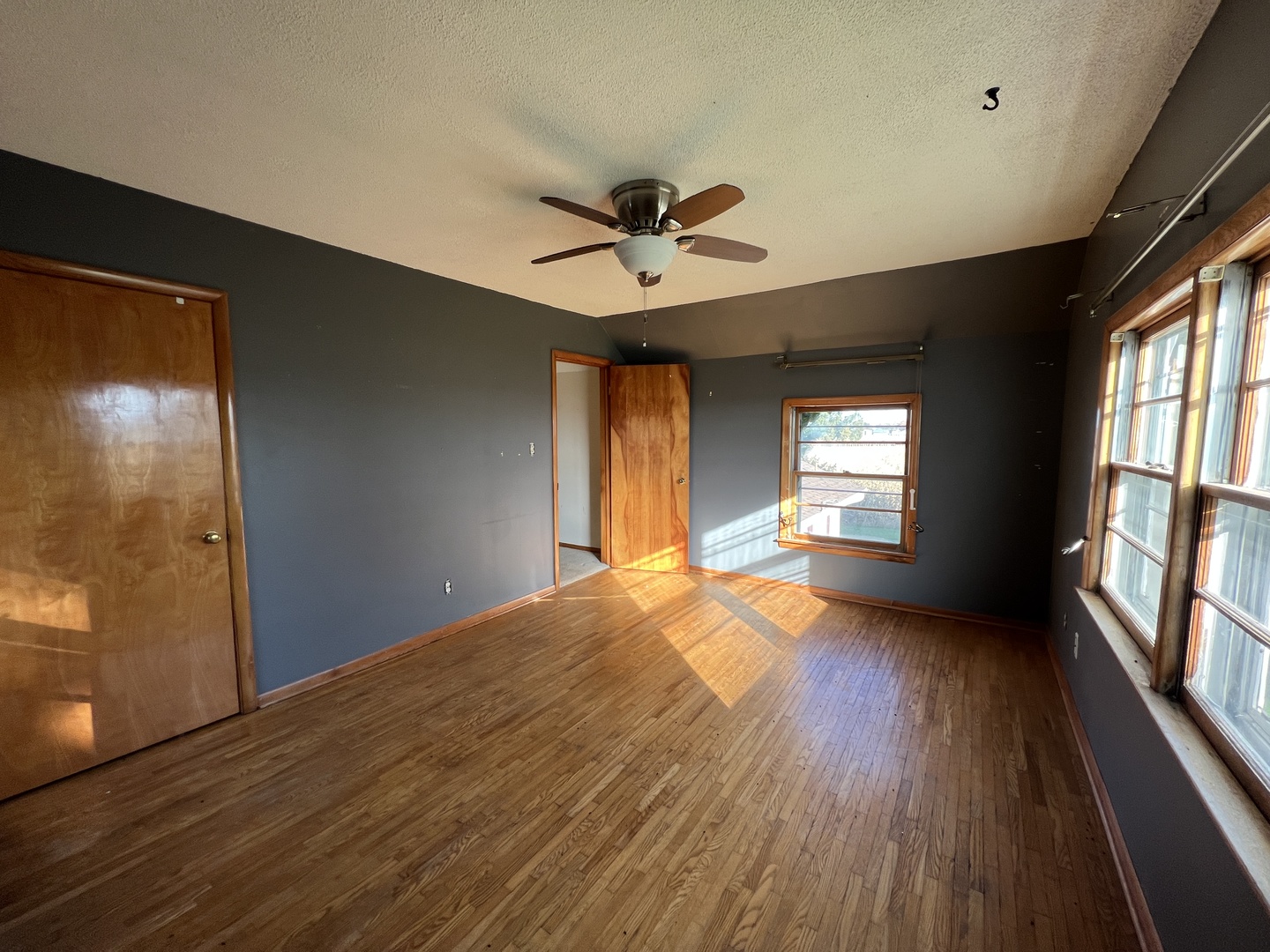48W137 Middleton Road Maple Park, IL 60151 - Photo 16 of 27 a view of an empty room with a window and wooden floor