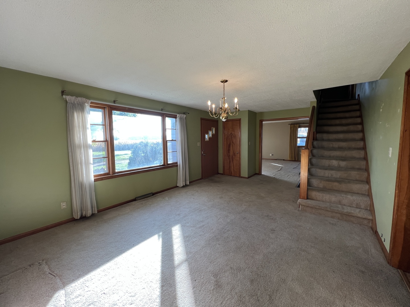 48W137 Middleton Road Maple Park, IL 60151 - Photo 8 of 27 a view of an empty room with a fireplace and a window
