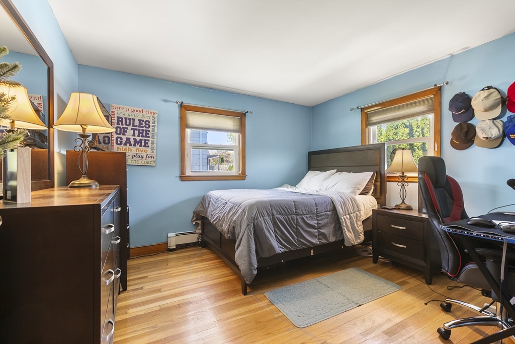 16 Homer Road Arlington, MA 02476 - Photo 20 of 28 a bedroom with a bed a dresser and next to a window