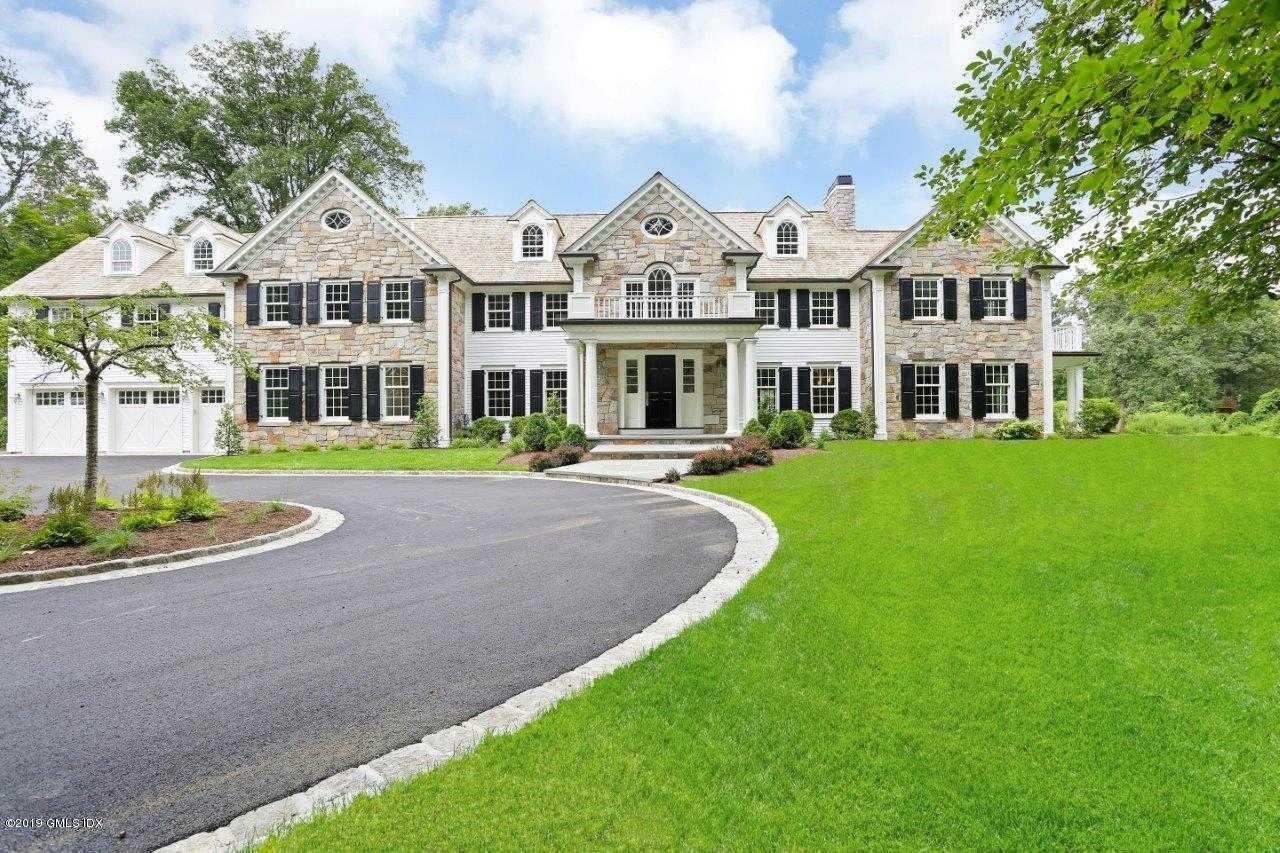 101 Dingletown Road Greenwich, CT 06830 - Photo 1 of 40 a front view of a building with a garden and trees