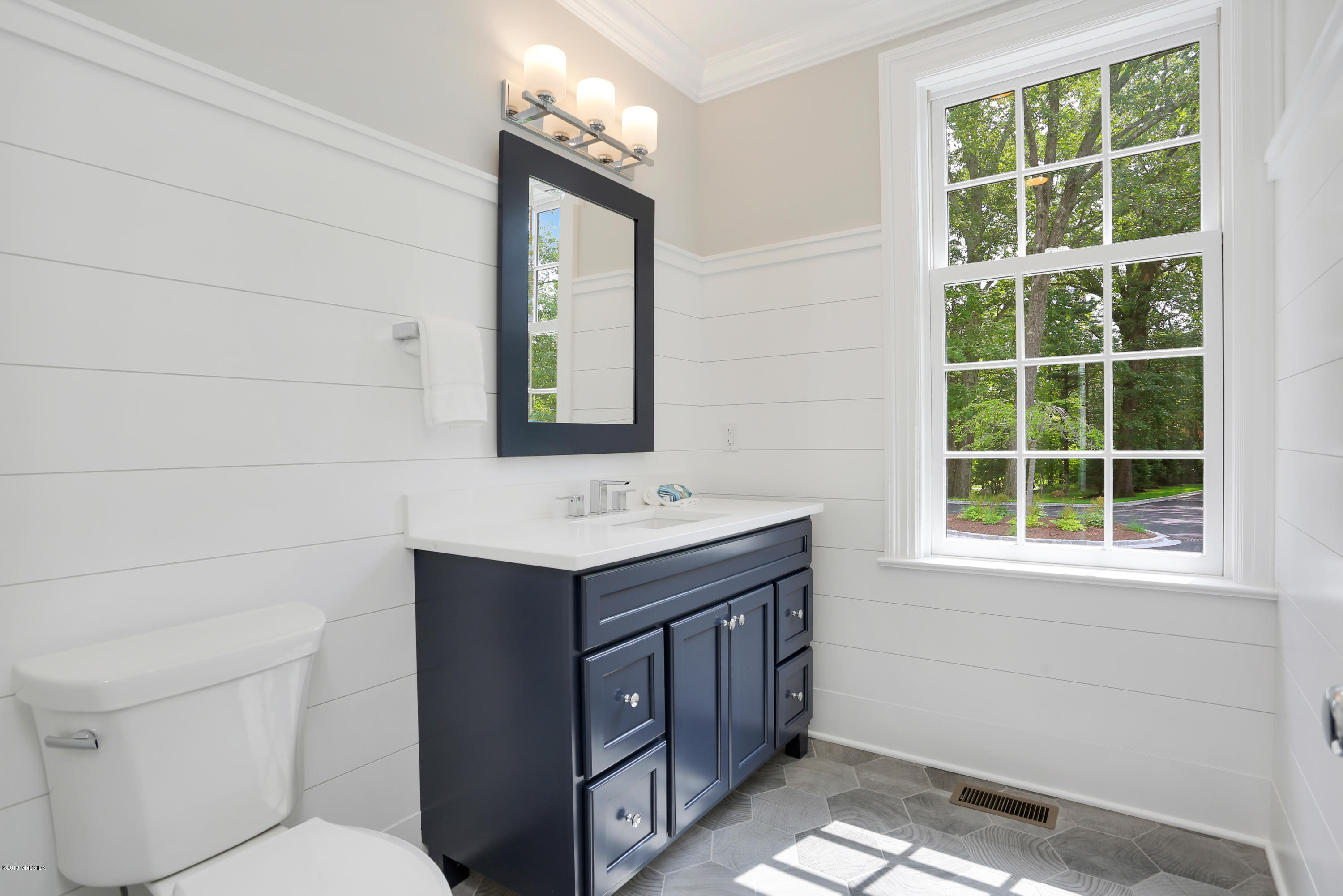 101 Dingletown Road Greenwich, CT 06830 - Photo 18 of 40 a bathroom with a sink a toilet and a mirror