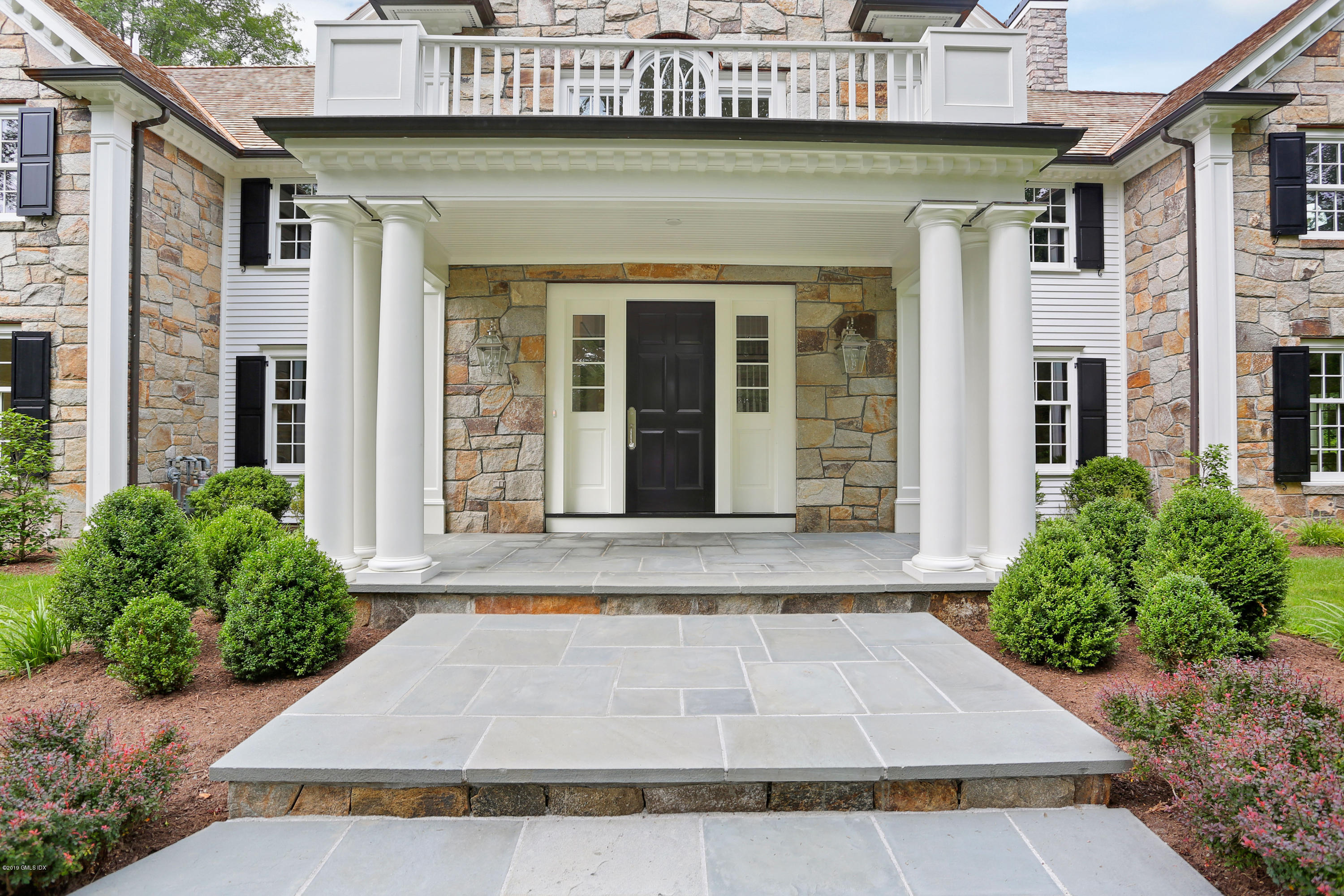 101 Dingletown Road Greenwich, CT 06830 - Photo 2 of 40 a front view of a house with garden