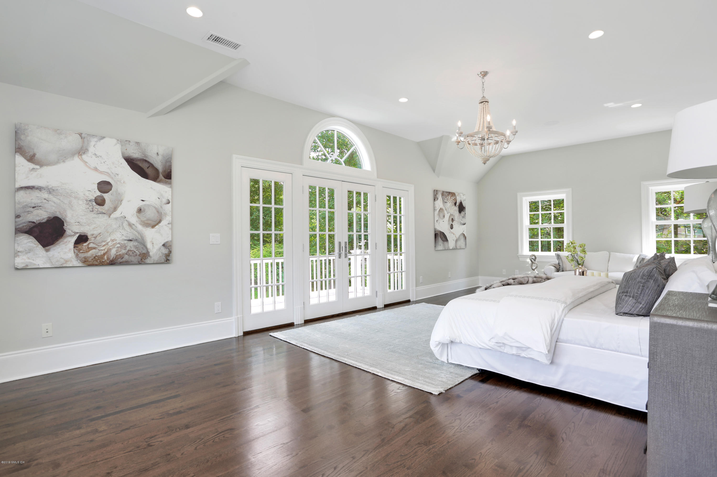 101 Dingletown Road Greenwich, CT 06830 - Photo 22 of 40 a bedroom with a large bed and a window