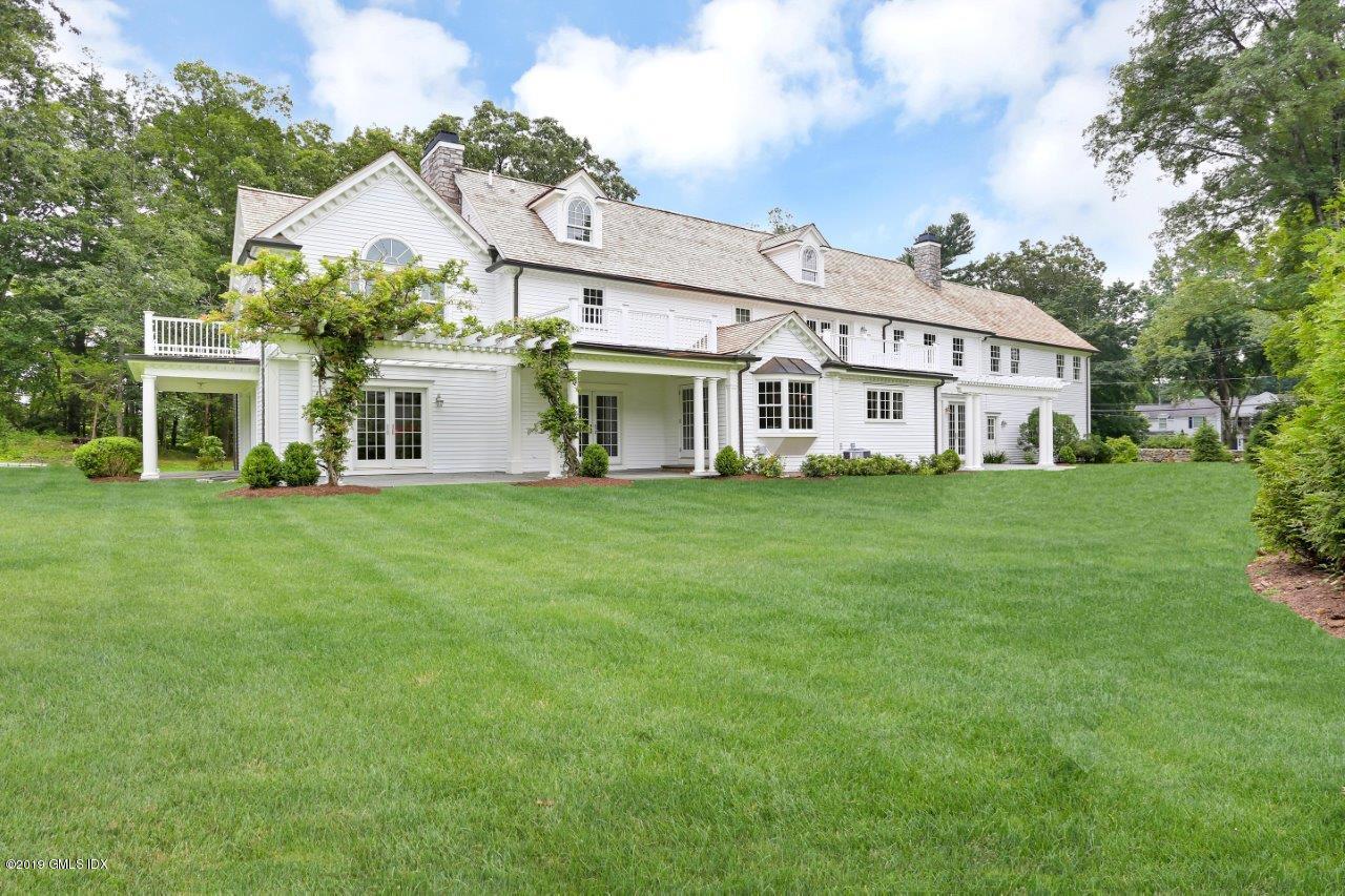 101 Dingletown Road Greenwich, CT 06830 - Photo 36 of 40 a view of a house with a big yard and potted plants