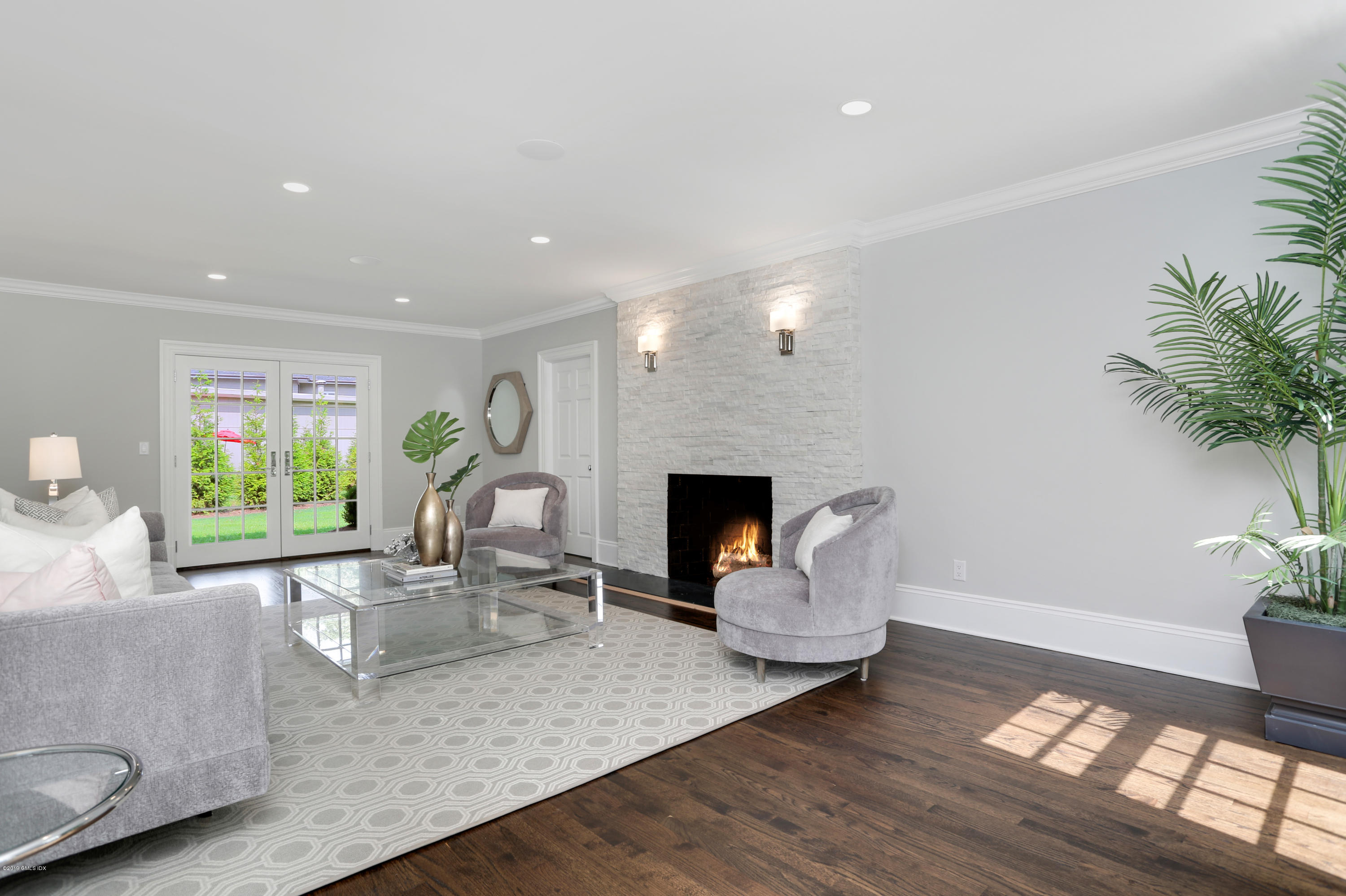101 Dingletown Road Greenwich, CT 06830 - Photo 5 of 40 a living room with furniture and a fireplace