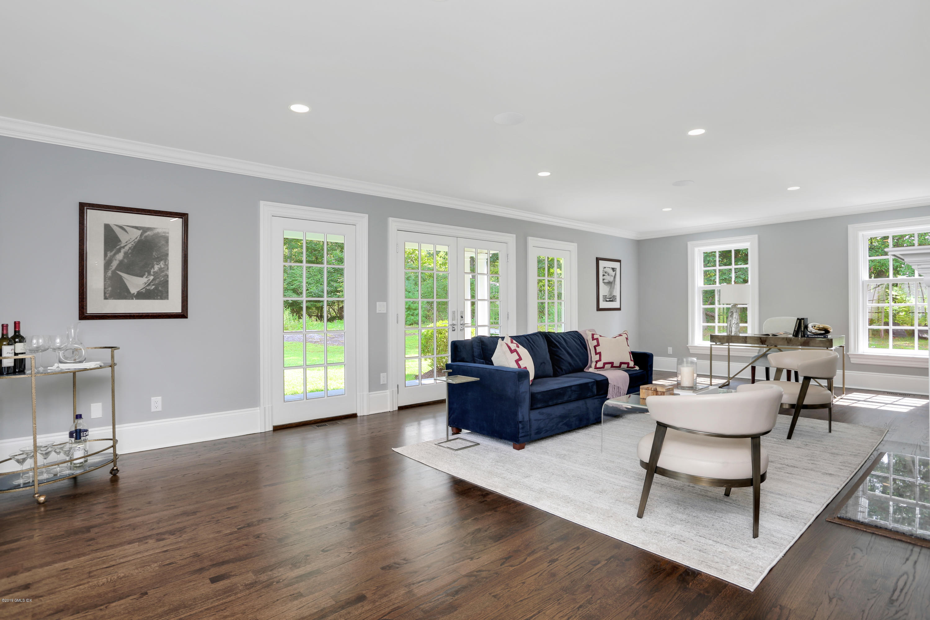 101 Dingletown Road Greenwich, CT 06830 - Photo 7 of 40 a living room with furniture large window and wooden floor