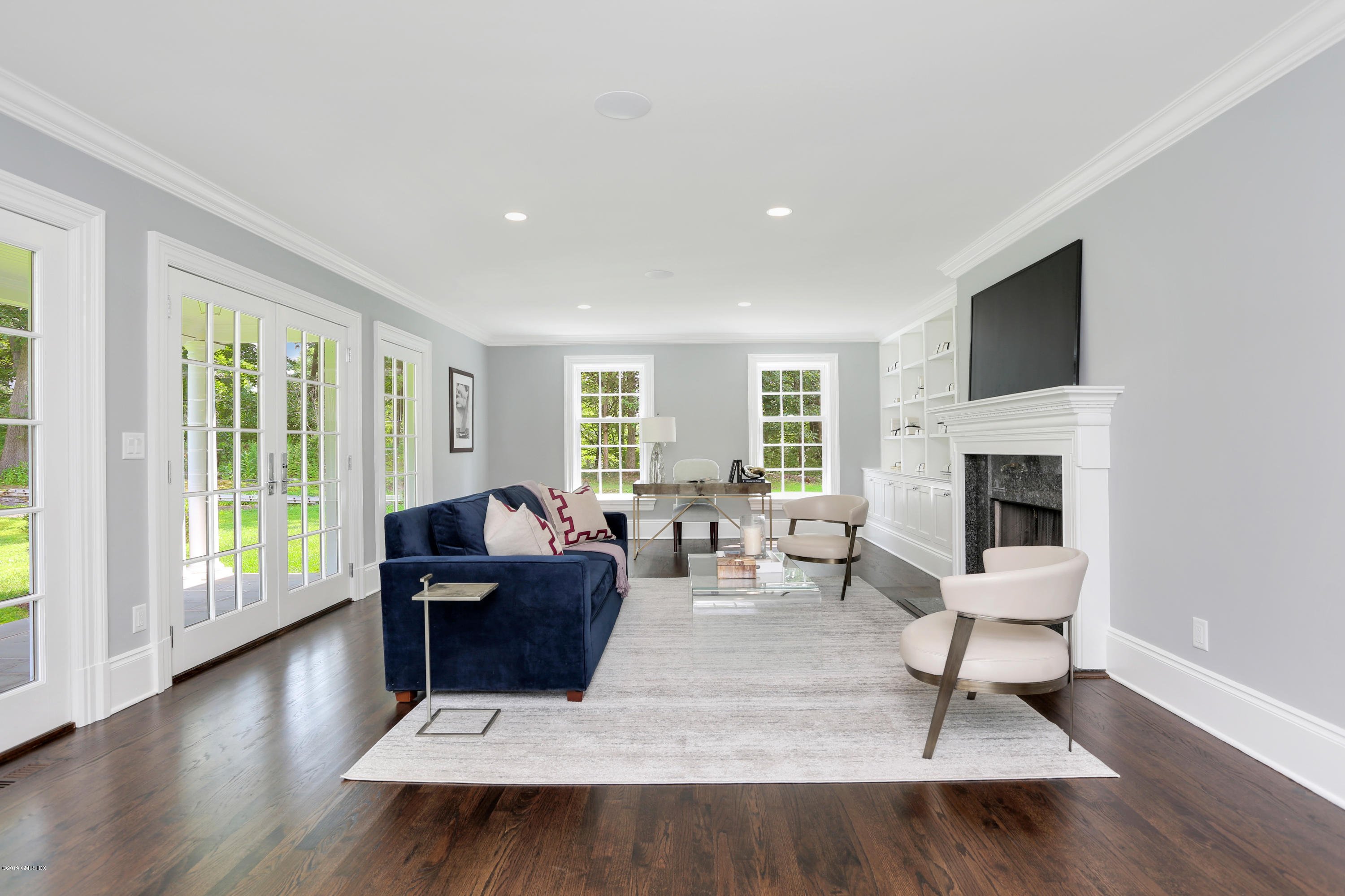 101 Dingletown Road Greenwich, CT 06830 - Photo 8 of 40 a living room with furniture and a fireplace
