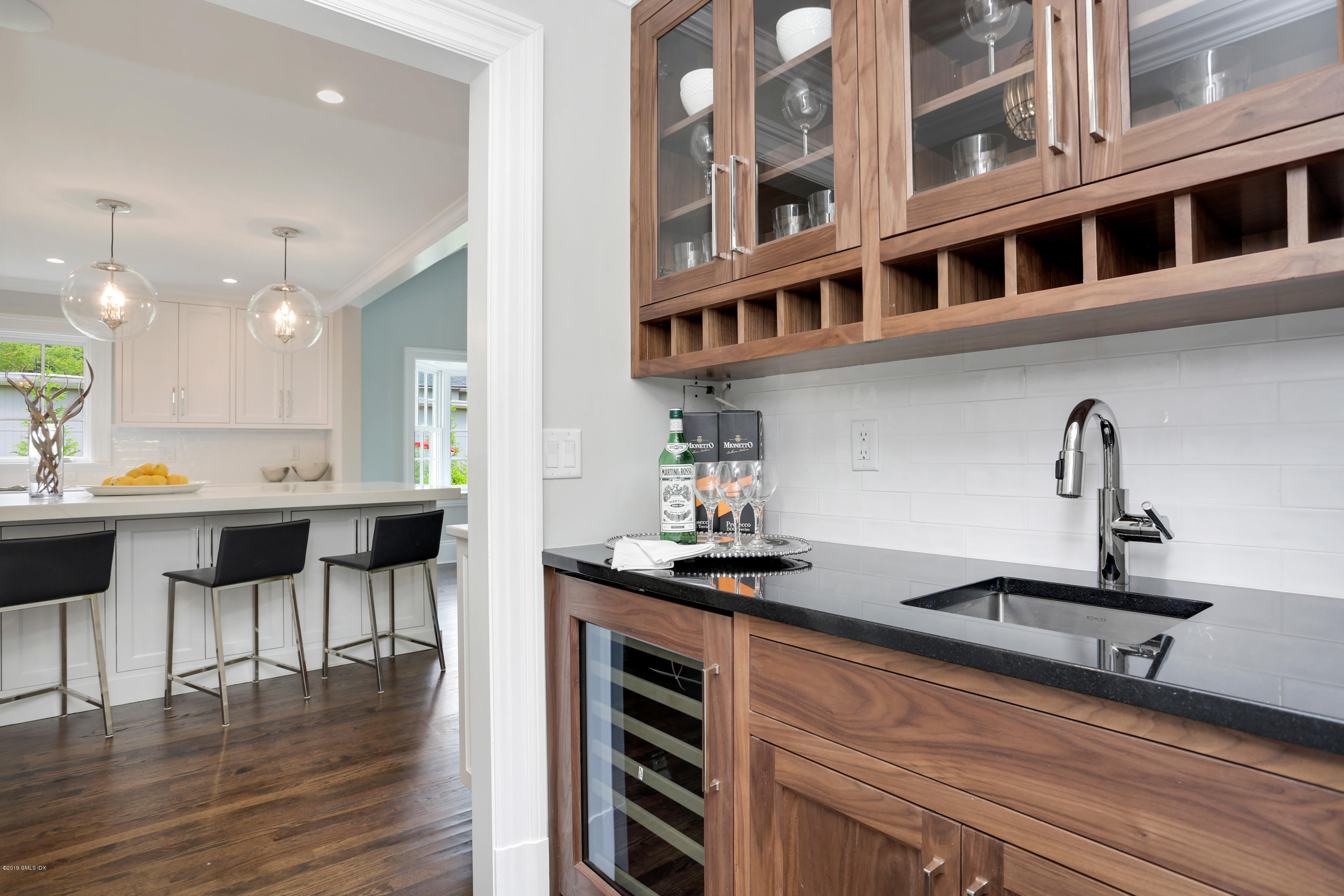 101 Dingletown Road Greenwich, CT 06830 - Photo 10 of 40 a kitchen with cabinets and chairs