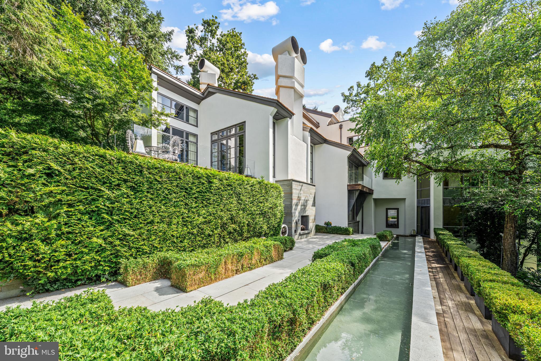 308-310 Julip Run Wayne, PA 19087 - Photo 114 of 127 a front view of a house with a yard and potted plants