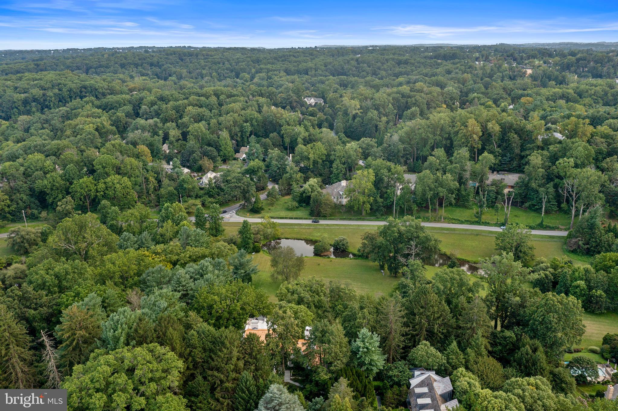 308-310 Julip Run Wayne, PA 19087 - Photo 124 of 127 a view of a lush green forest with a houses