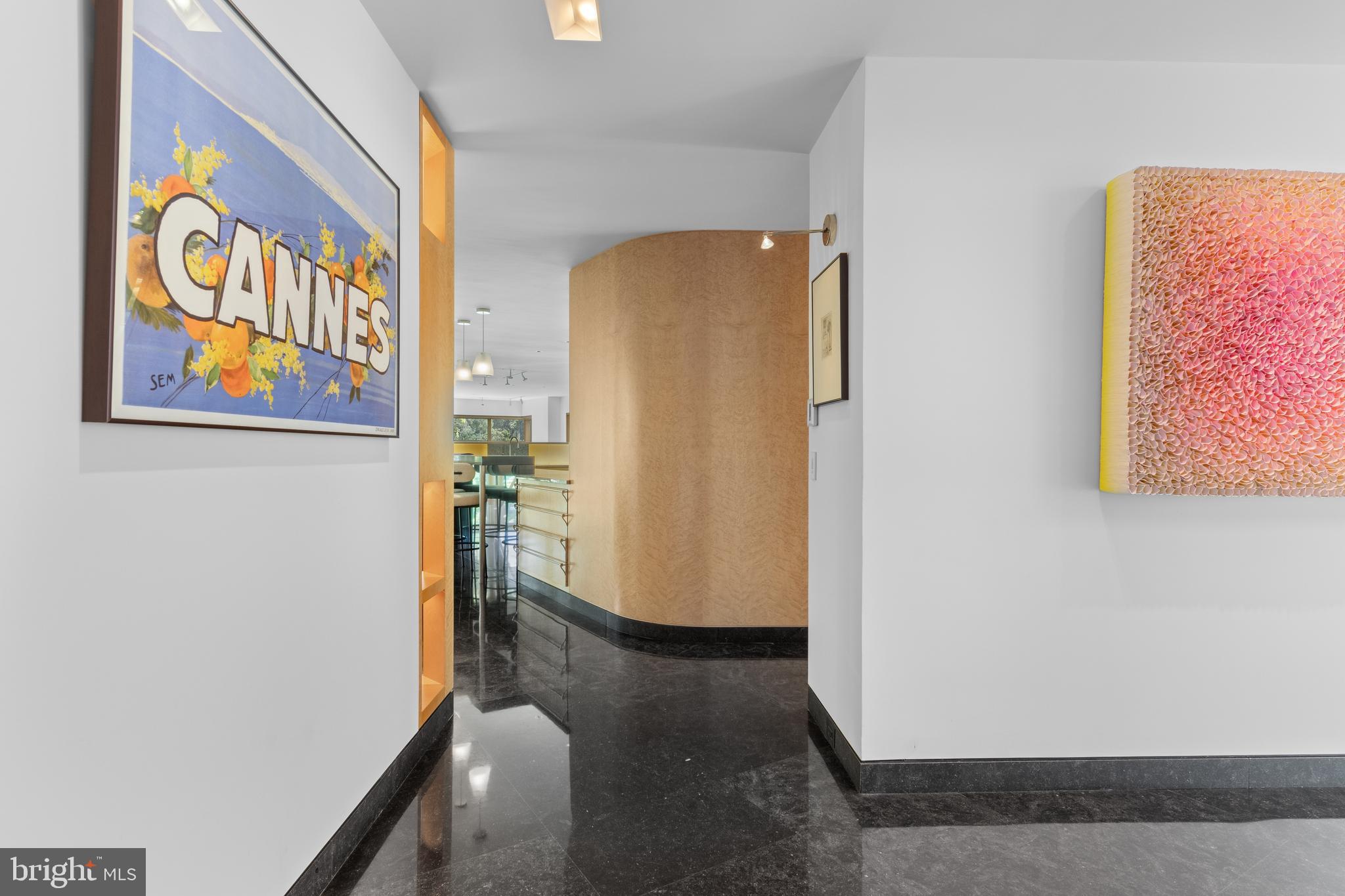 308-310 Julip Run Wayne, PA 19087 - Photo 21 of 127 a view of a hallway with paintings on the wall